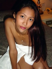 Beautiful young Thai girl shy to remove bath towel